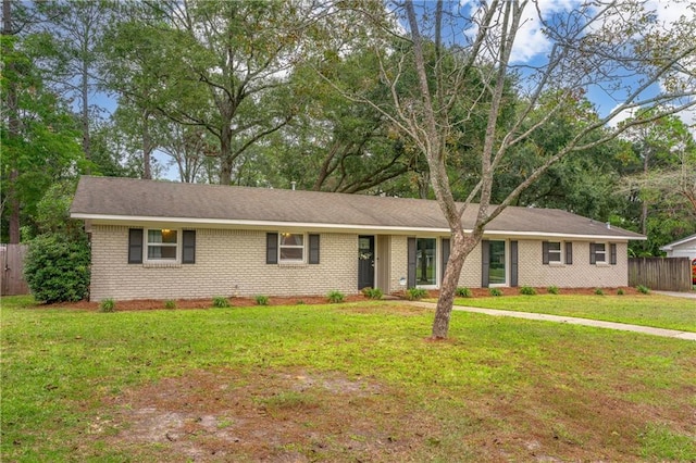 single story home with a front yard