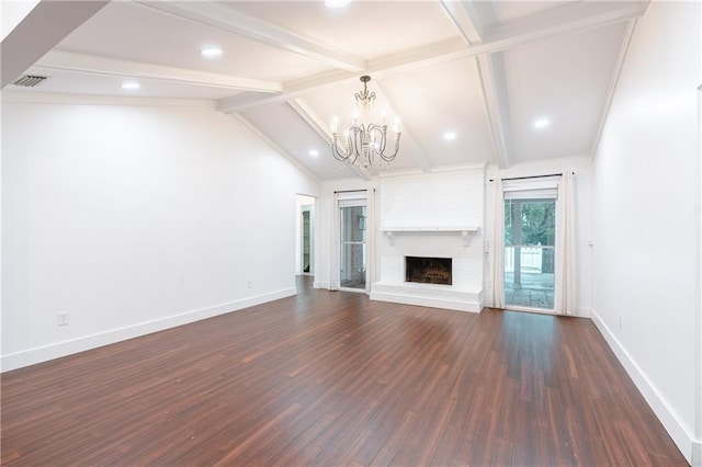 unfurnished living room with a brick fireplace, lofted ceiling with beams, dark wood-type flooring, and a notable chandelier