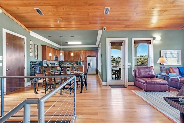 dining area with light hardwood / wood-style flooring, wooden ceiling, and crown molding