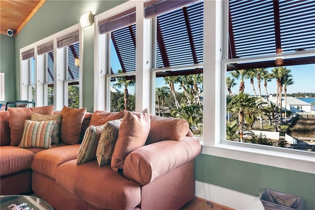 living room with lofted ceiling and plenty of natural light