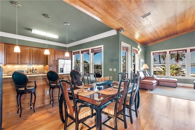 dining area with light wood-type flooring, a healthy amount of sunlight, vaulted ceiling, and wooden ceiling