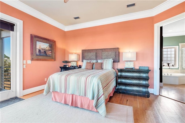 bedroom featuring light hardwood / wood-style flooring, ensuite bath, access to outside, and crown molding