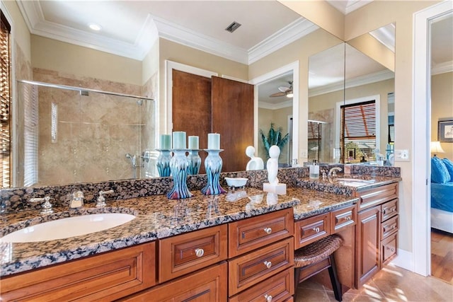 bathroom featuring ceiling fan, vanity, walk in shower, and ornamental molding