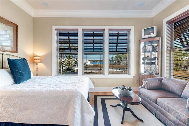 bedroom featuring hardwood / wood-style flooring and ornamental molding