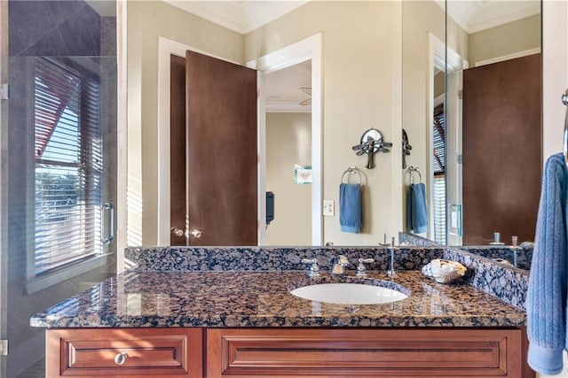 bathroom with ornamental molding and vanity