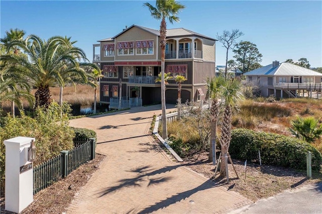 back of property with a balcony