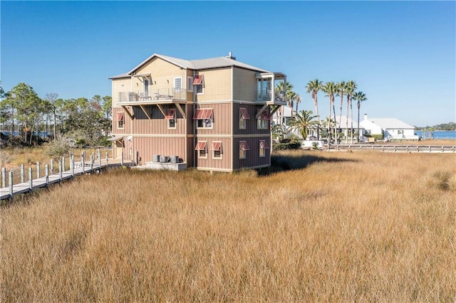 rear view of property with a water view