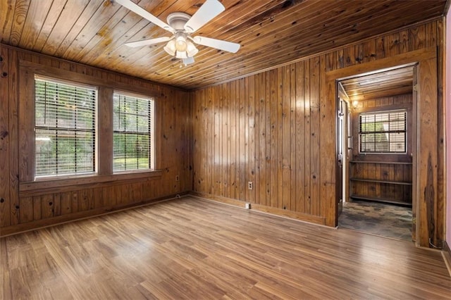 4221 Bay Front Rd, Mobile, AL 36605 - spare room featuring wood finished floors, wood walls, ceiling fan, baseboards, and wood ceiling