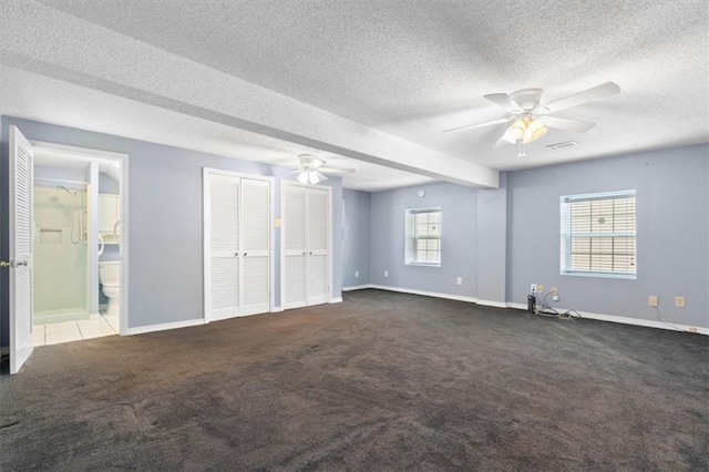 4221 Bay Front Rd, Mobile, AL 36605 - unfurnished bedroom with carpet floors, baseboards, a textured ceiling, two closets, and ensuite bath