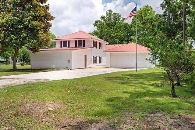 4221 Bay Front Rd, Mobile, AL 36605 - view of front facade featuring a garage, an outdoor structure, a front yard, and metal roof