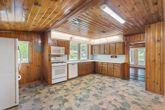 4221 Bay Front Rd, Mobile, AL 36605 - kitchen featuring white appliances, wood ceiling, stone finish floors, brown cabinets, and light countertops