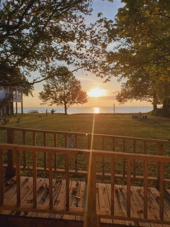 4221 Bay Front Rd, Mobile, AL 36605 - gate at dusk featuring a deck with water view