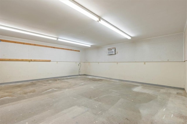 4221 Bay Front Rd, Mobile, AL 36605 - garage featuring an AC wall unit and baseboards