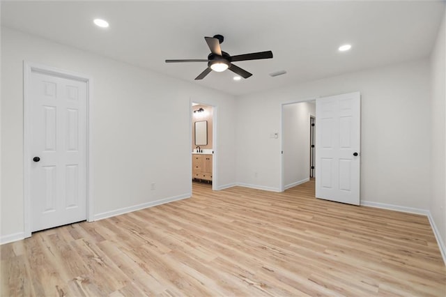 unfurnished bedroom with light wood finished floors, recessed lighting, and baseboards