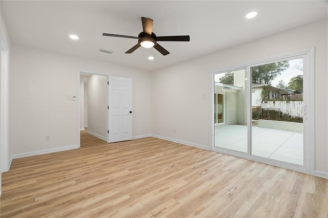 spare room with recessed lighting, light wood-style flooring, and baseboards