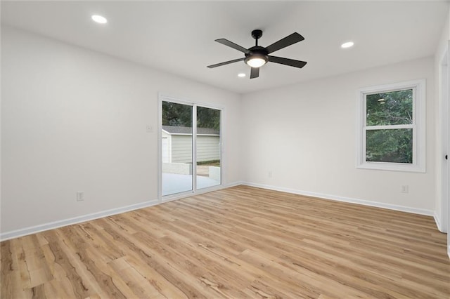 unfurnished room featuring light wood-type flooring, baseboards, and recessed lighting