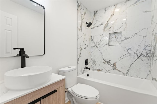 bathroom with  shower combination, toilet, and vanity