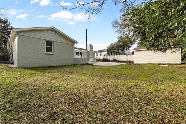 view of yard with central AC unit, a patio area, and fence