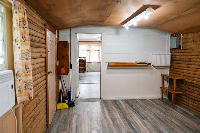 interior space with wood finished floors and electric panel