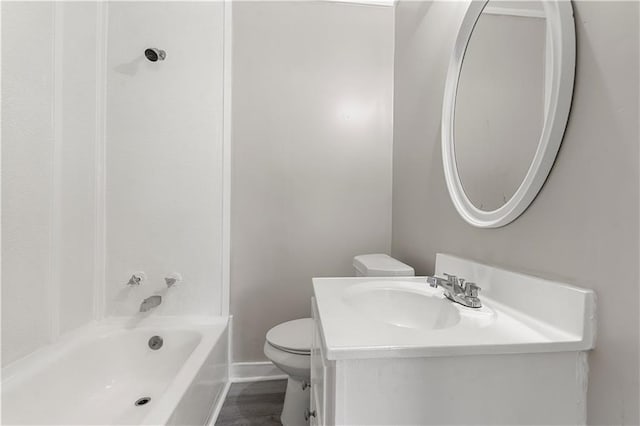 full bathroom with hardwood / wood-style flooring, toilet, vanity, and  shower combination