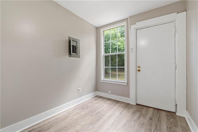 foyer with lofted ceiling and light wood-type flooring