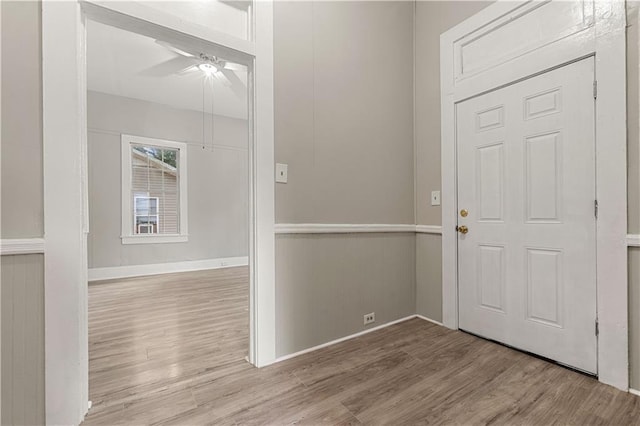 foyer featuring light wood-type flooring and ceiling fan