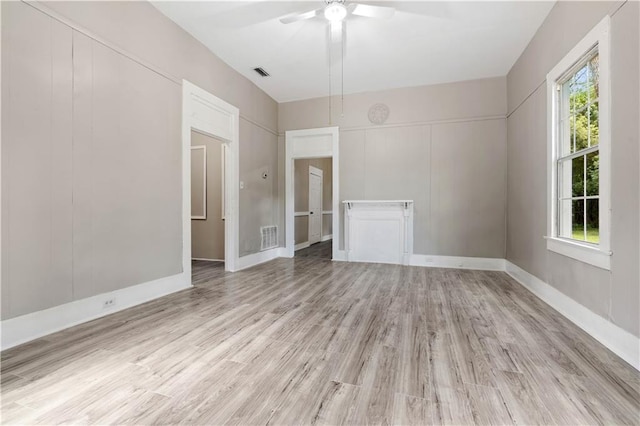 empty room featuring ceiling fan and light hardwood / wood-style flooring