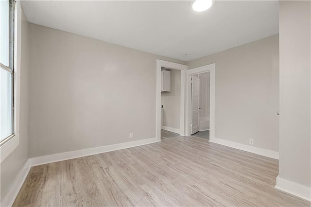 spare room with light wood-type flooring