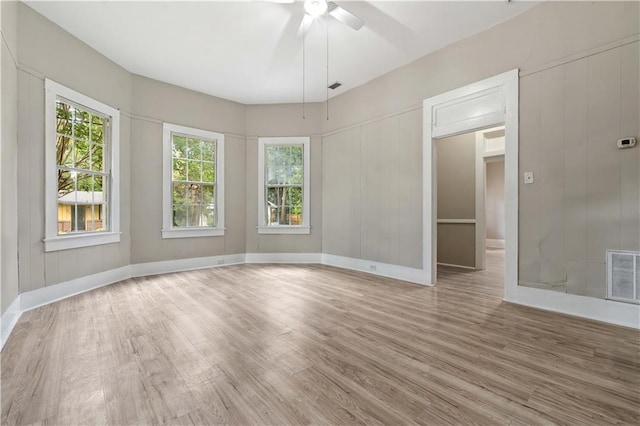 spare room featuring ceiling fan and hardwood / wood-style flooring