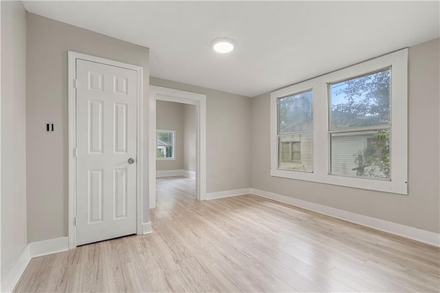 spare room featuring light hardwood / wood-style floors