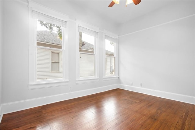 spare room featuring hardwood / wood-style floors and ceiling fan