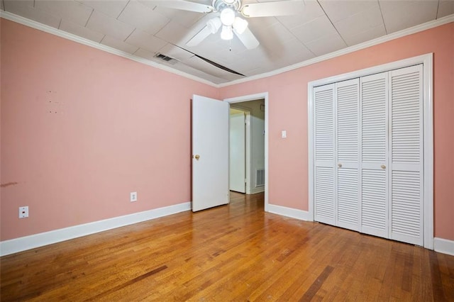 5405 Dogwood Ct, Mobile, AL 36693 - unfurnished bedroom featuring baseboards, light wood-type flooring, ornamental molding, a closet, and ceiling fan
