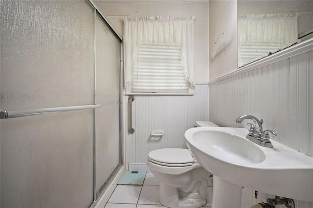 5405 Dogwood Ct, Mobile, AL 36693 - bathroom with a shower stall, tile patterned floors, toilet, and a wainscoted wall