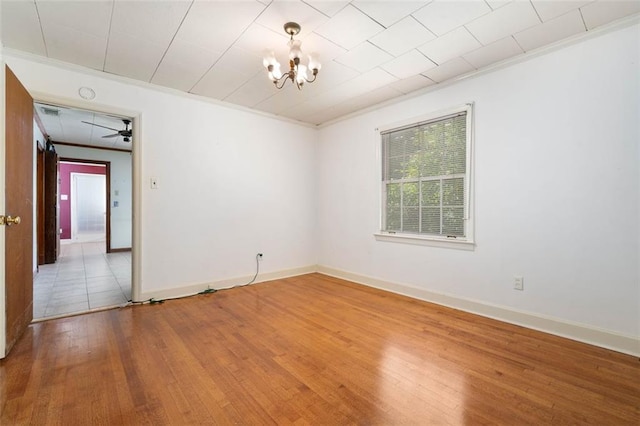 5405 Dogwood Ct, Mobile, AL 36693 - spare room featuring ornamental molding, hardwood / wood-style flooring, a chandelier, and baseboards