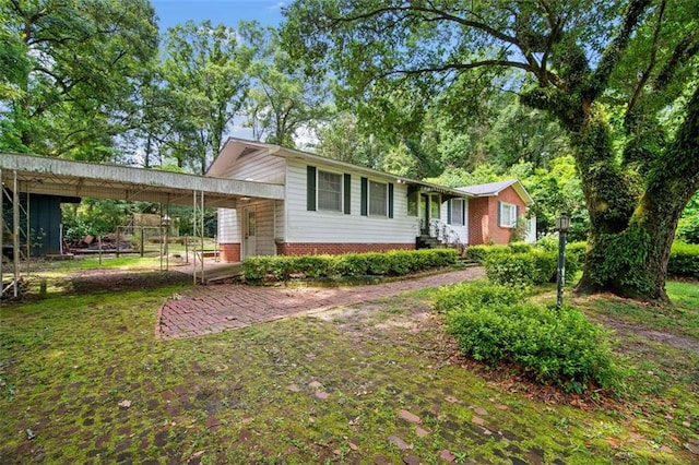 5405 Dogwood Ct, Mobile, AL 36693 - view of front of house with brick siding, an attached carport, and entry steps