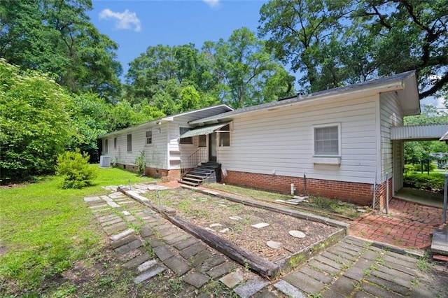5405 Dogwood Ct, Mobile, AL 36693 - back of house with a lawn and central AC unit