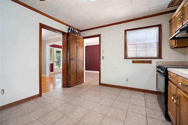 5405 Dogwood Ct, Mobile, AL 36693 - kitchen with black range oven, crown molding, brown cabinetry, light countertops, and baseboards