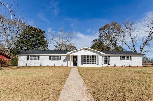 ranch-style house with a front lawn