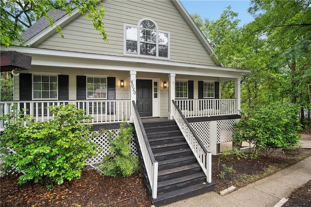 view of front facade with covered porch and stairway