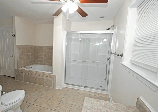 bathroom featuring ceiling fan, shower with separate bathtub, tile patterned flooring, and toilet