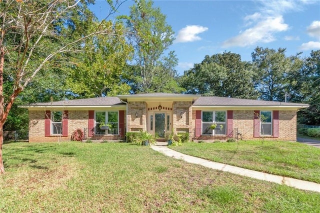 single story home featuring a front yard and a porch