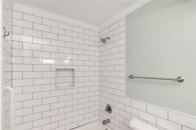 bathroom featuring crown molding, tile walls, toilet, and tiled shower / bath