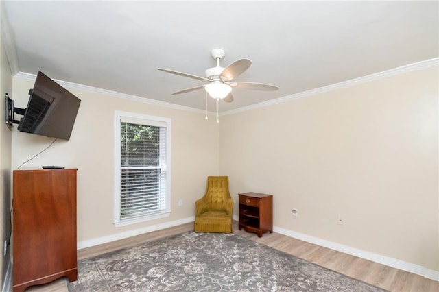 unfurnished room with crown molding, wood-type flooring, and ceiling fan