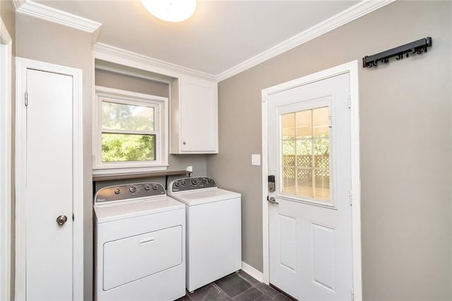 washroom with independent washer and dryer, a healthy amount of sunlight, ornamental molding, and cabinets