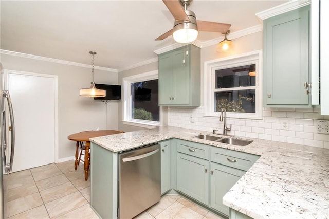 kitchen with dishwasher, decorative backsplash, green cabinets, sink, and pendant lighting