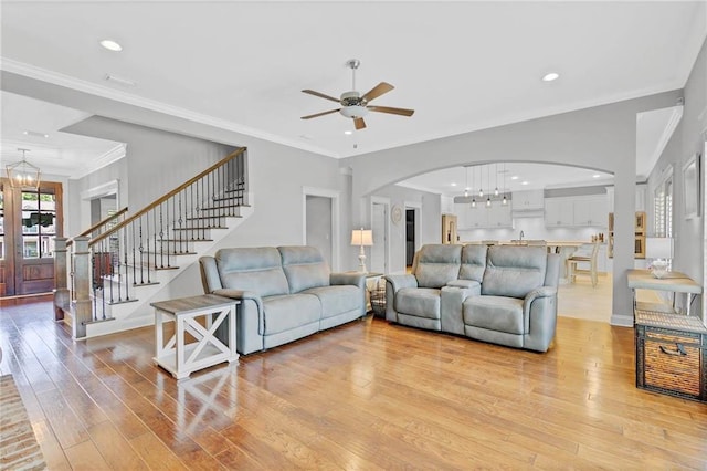8662 Daintree Ct, Daphne, AL 36526 - living room with arched walkways, a chandelier, ceiling fan, light wood-style flooring, and recessed lighting