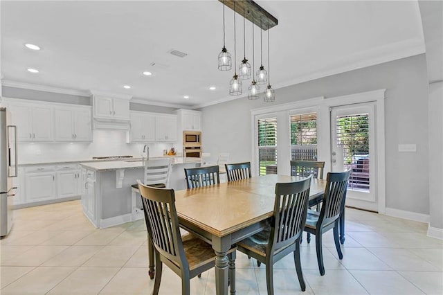 8662 Daintree Ct, Daphne, AL 36526 - dining room featuring crown molding, light tile patterned flooring, and recessed lighting