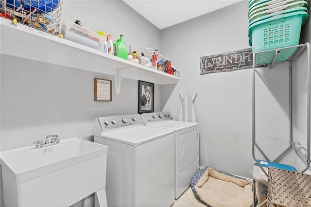 8662 Daintree Ct, Daphne, AL 36526 - laundry area with washing machine and dryer and light tile patterned flooring