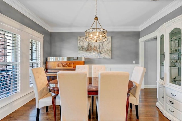 8662 Daintree Ct, Daphne, AL 36526 - dining space with a chandelier, dark wood-style floors, and crown molding