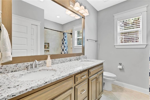8662 Daintree Ct, Daphne, AL 36526 - bathroom with double vanity, tile patterned flooring, and a tile shower